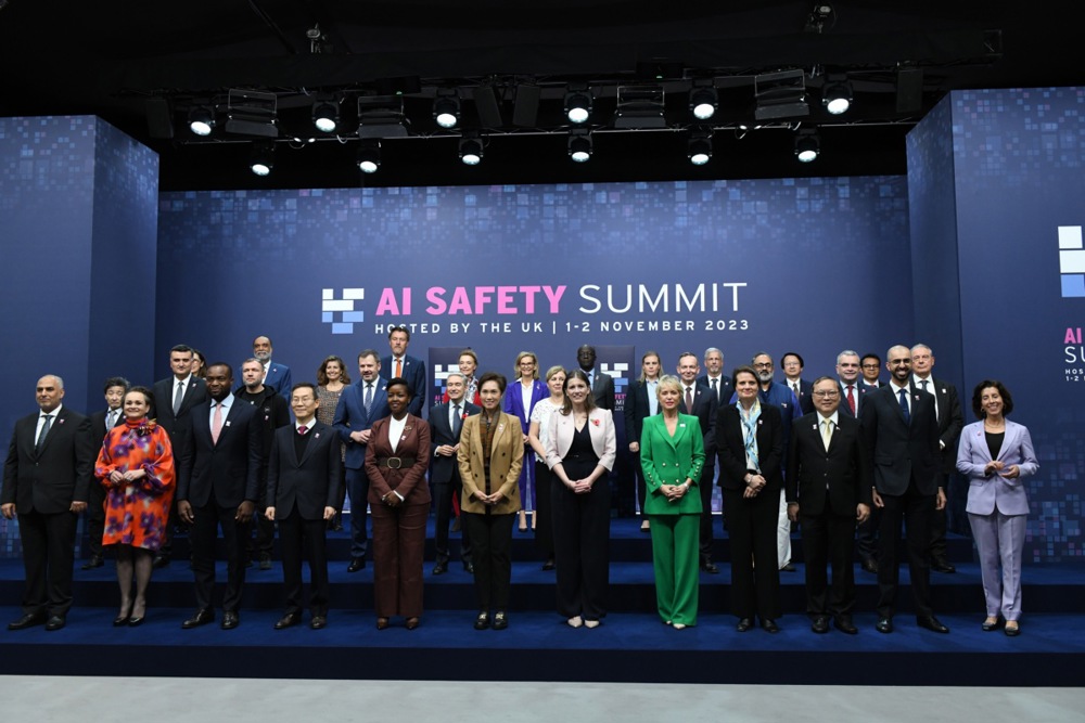 UK science, innovation and technology secretary Michelle Donelan (C) with international ministers during a 'family photo' at the AI Safety Summit 2023 at Bletchley Park in Bletchley, Britain, 01 November 2023. The two-day summit was prompted by UK concerns about powerful artificial intelligence models expected to be released next year, which will have capabilities the government fears not even developers understand. 