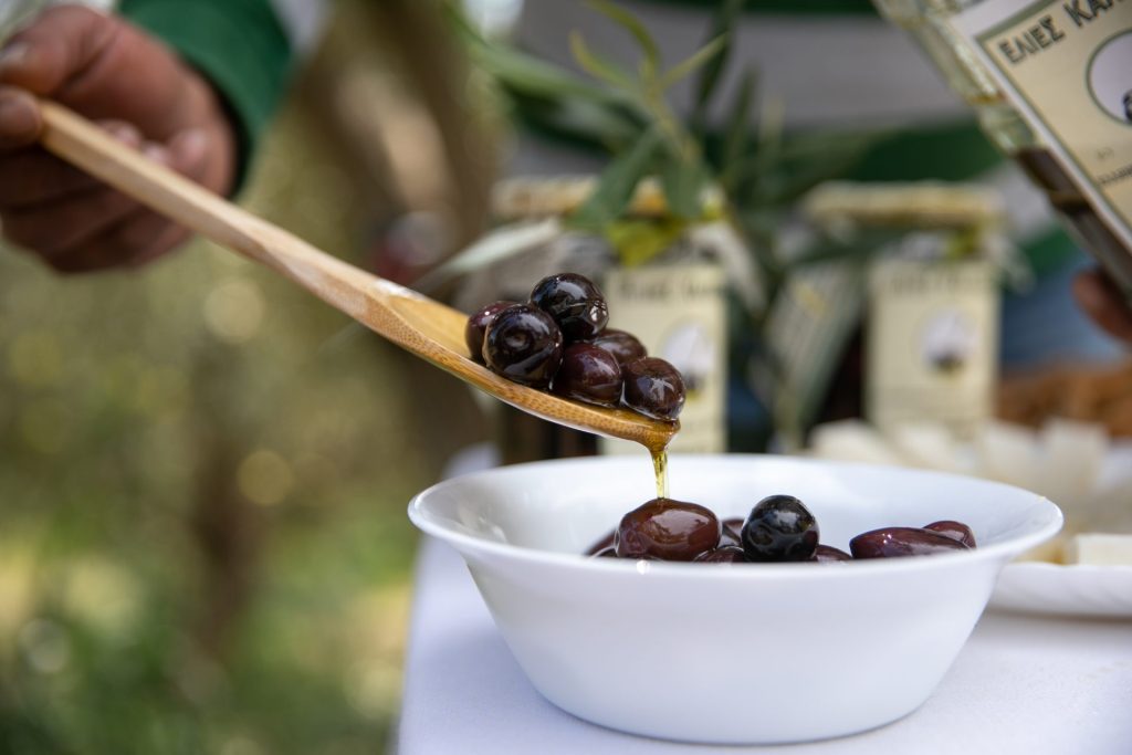 Photo taken on April 1, 2021 shows a bowl of Kalamata olives preserved in olive oil and brine in Messinia, Greece. Known as the "black queen" of all Greek olives, the Kalamata, grown in the sun-kissed olive groves around Messinia in the southwestern part of the Peloponnese.