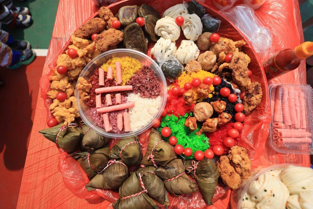 Photo taken on April 9, 2024 shows Zhuang ethnic food at the Hundred feast at Rongan Experimental Primary School in Liuzhou City, South China s Guangxi Zhuang Autonomous region. Nanning Guangxi China