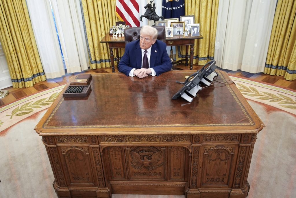 Donald Trump signs an executive order - Washington United States President Donald Trump sits in the Oval Office of the White House in Washington, DC after signing executive orders on January 23, 2025.