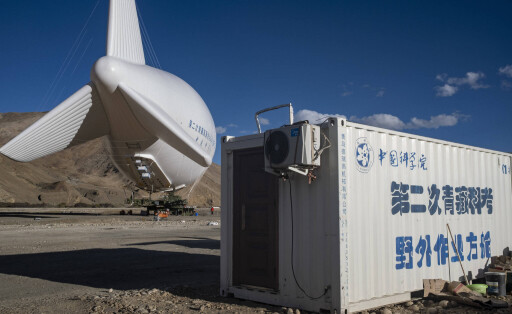 220515 -- MOUNT QOMOLANGMA BASE CAMP, May 15, 2022 -- Photo taken on May 14, 2022 shows floating airship Jimu No.1 type III in Zhaxizom Township of Tingri County, southwest China s Tibet Autonomous Region. China s self-developed floating airship, designed for atmosphere observation, reached a record altitude of 9,032 meters in Tibet Autonomous Region on Sunday, according to its developer. Developed by the Aerospace Information Research Institute of the Chinese Academy of Sciences CAS, the floating airship Jimu No.1 type III has a volume of 9,060 cubic meters. CHINA-FLOATING AIRSHIP-RECORD CN SunxFei PUBLICATIONxNOTxINxCHN