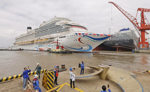 SHANGHAI, CHINA - JUNE 06: People take photos during the launching ceremony of China s first domestically-built large cruise ship Adora Magic City at a shipyard of Shanghai Waigaoqiao Shipbuilding Co., Ltd on June 6, 2023 in Shanghai, China. The cruise ship, measuring 323.6 meters in length and 37.2 meters in width with a gross tonnage of 135,500 tonnes, can accommodate a total of 5,246 passengers. PUBLICATIONxINxGERxSUIxAUTxHUNxONLY Copyright: xChinaxNewsxServicex 111439964928