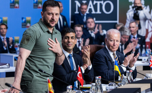 Ukrainian President Volodymyr Zelensky (L), British Prime Minister Rishi Sunak (C), and U.S. President Joe Biden (R), at