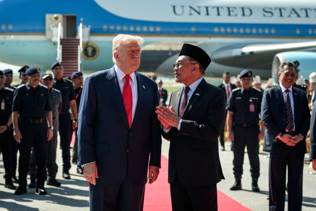 U.S. President Donald Trump is greeted by Malaysian Prime Minister Anwar Ibrahim upon arrival at Kuala Lumpur International Airport in Kuala Lumpur, Malaysia, on Sunday, October 26, 2025, where he will attend the 47th Association of Southeast Asian Nations (ASEAN) summit.
