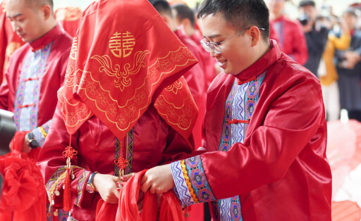 210520 -- CHONGQING, May 20, 2021 -- The brides and grooms are seen during a collective wedding ceremony at the main venue of the World Bee Day Celebration in China in Zhongyi Township of Shizhu Tujia Autonomous County, southwest China s Chongqing, May 20, 2021. May 20 marks the World Bee Day. This year s World Bee Day Celebration in China, themed Honeybee, Big Dreams, A program for Rural Revitalization , was held in Zhongyi Township of Shizhu County. In recent years, China s beekeeping industry has made a lot of remarkable practices in promoting poverty alleviation and rural revitalization, and has helped many impoverished households to lift themselves out of poverty and increase their income. The current development of beekeeping indu PUBLICATIONxNOTxINxCHN