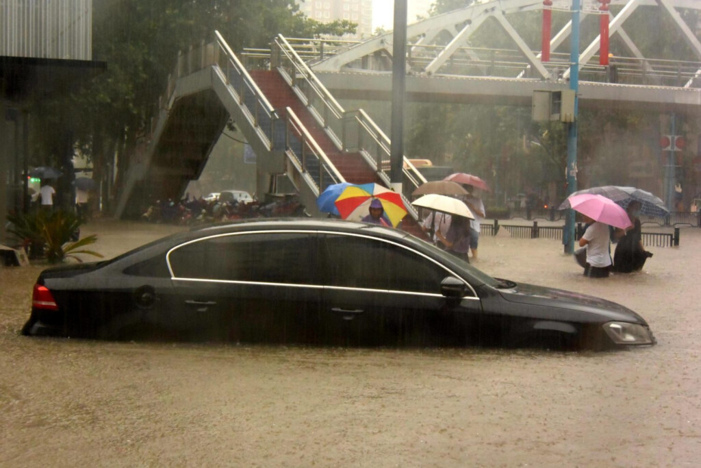 210720 -- ZHENGZHOU, July 20, 2021 -- A car is inundated by rainwater in Zhengzhou, capital of central China s Henan Province, July 20, 2021. More than 144,660 residents have been affected by torrential rains in central China s Henan Province since July 16, and 10,152 have been relocated to safe places, the provincial flood control and drought relief headquarters said Tuesday. A total of 16 large and medium-sized reservoirs have seen water levels rise above the alert level after torrential rains battered most parts of the province on Monday and Tuesday. CHINA-HENAN-ZHENGZHOU-HEAVY RAINFALL CN ZhuxXiang PUBLICATIONxNOTxINxCHN