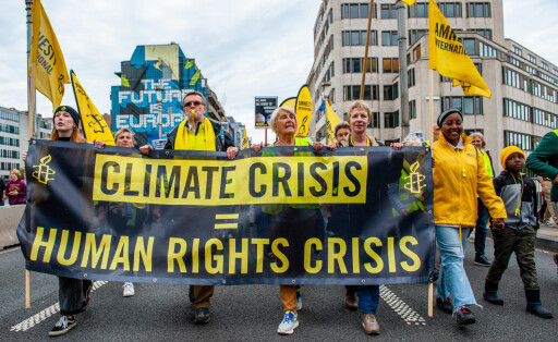 Walk For Your Future Climate March Organized In Brussels People are holding a banner from Amnesty International, during