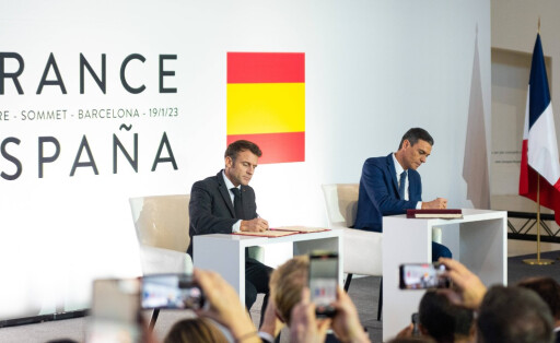 Spanish President Pedro Sanchez and French President Emmanuel Macron are seen during the signing of the agreement during the 27th Spain-France Summit