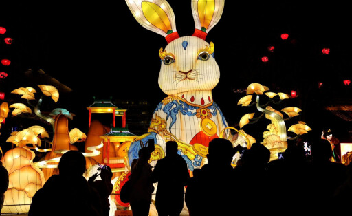 230131 -- ZAOZHUANG, Jan. 31, 2023 -- People watch a gigantic rabbit-shaped lantern in celebration of the upcoming Latern Festival at Taierzhuang ancient city of Zaozhuang, east China s Shandong Province, Jan. 30, 2023. The Lantern Festival, the 15th day of the first month of the Chinese lunar calendar, falls on Feb. 5 this year. The festival features family reunions, feasts, light shows and various cultural activities. Photo by /Xinhua CHINA-LANTERN FESTIVAL-CELEBRATIONS CN SunxZhongzhe PUBLICATIONxNOTxINxCHN