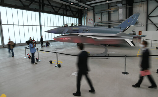 epa08675761 A model of a remote carrier drone and a Eurofighter jet are displayed in a hangar during a visit of German and French defense officials to the Airbus military aviation center in Manching, Germany, 17 September 2020. German Defense Minister Annegret Kramp-Karrenbauer and French Defense Minister Florence Parly are in Manching to be informed among others of the Future Combat Air System (FCAS), the next-generation fighter jet program, that is developed together by Germany, France and Spain. EPA-EFE/PHILIPP GUELLAND