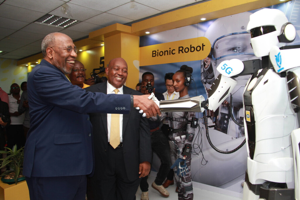 200117 -- KAMPALA, Jan. 17, 2020 -- Uganda s Prime Minister Ruhakana Rugunda L, Front shakes hands with a robot that uses the 5G network during a 5G technology trial ceremony in Kampala, capital of Uganda, on Jan. 17, 2020. China s ZTE and MTN Uganda on Friday started 5G technology trial here to be the first who brings the Standalone 5G network into reality in east Africa as the region awaits it commercial roll out. Photo by Zhang Gaiping/Xinhua UGANDA-KAMPALA-MTN UGANDA-CHINA-ZTE-5G TRIAL ZhangxGaipingdaixiugai PUBLICATIONxNOTxINxCHN