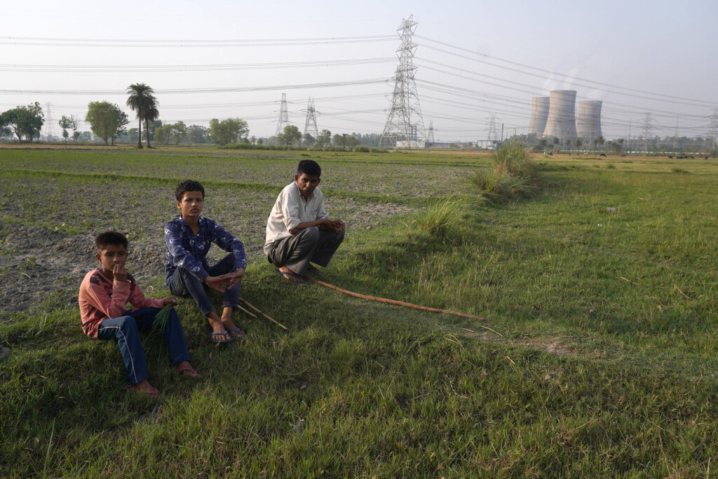INDIA-POWER-COAL A man along with his kids rest in the field near a coal-fired thermal Power Plant of National Thermal Power Corporation NTPC, at Dadri in Gautam Budh Nagar district, Uttar Pradesh, India on May 5, 2022. Amid the rampant rise in power demand due to the prevailing heatwave, India is staring at a coal crisis, with stock critically low at 108 of its 173 thermal power plants. The power cuts are sparking scrutiny of countrys long reliance on coal, which is responsible for about 70% of India s electricity generation. Dadri India PUBLICATIONxNOTxINxFRA Copyright: xMayankxMakhijax originalFilename: makhija-notitle220505_npAn0.jpg