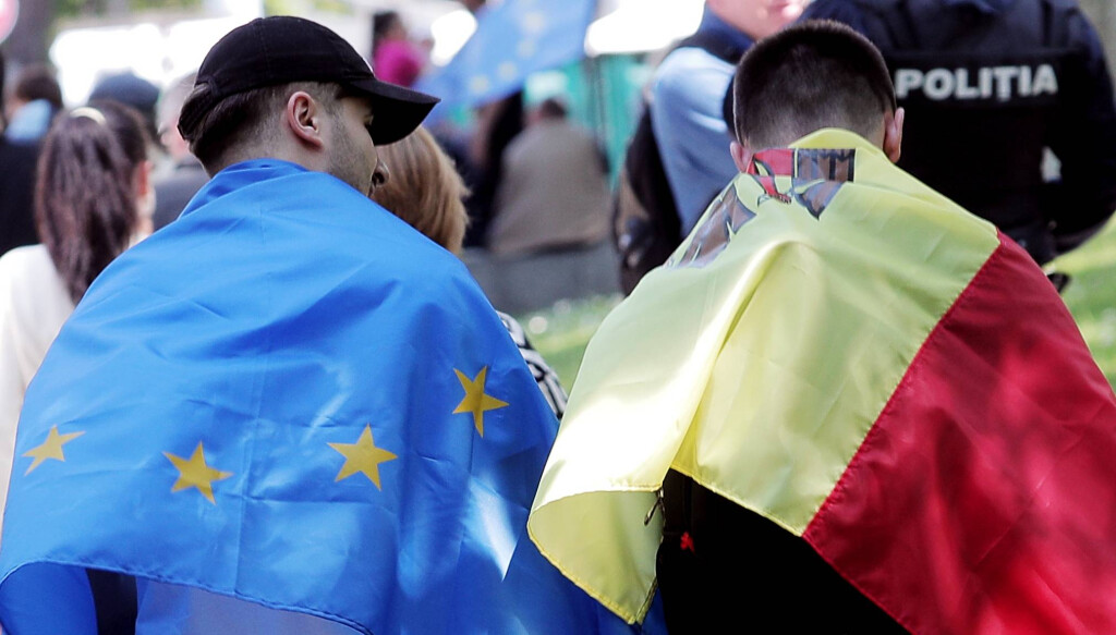 Moldova Politics Rally 8438983 21.05.2023 Men wrapped in EU and Moldovan flags attend a pro-European rally at call of Mo