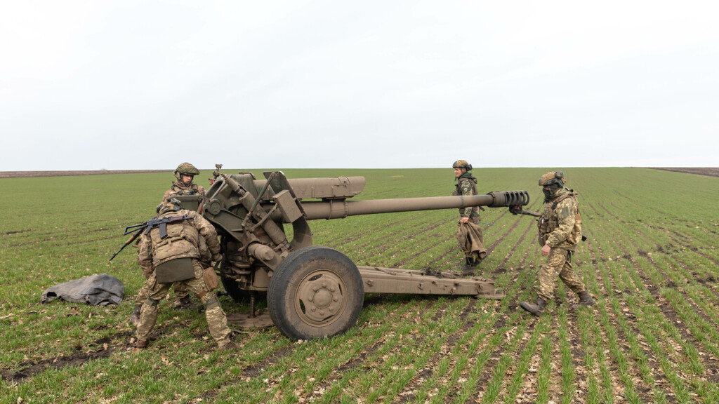 March 21, 2023, Donetsk region, Ukraine: A Ukrainian soldier is seen preparing to fire the 122 mm D-30 howitzer at a tar