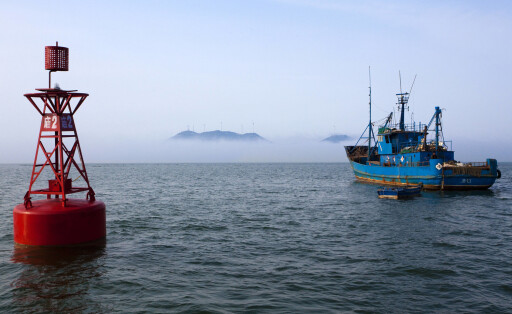 Fishing boat at sea Beijing China Copyright: xLianxFeix bji01990096