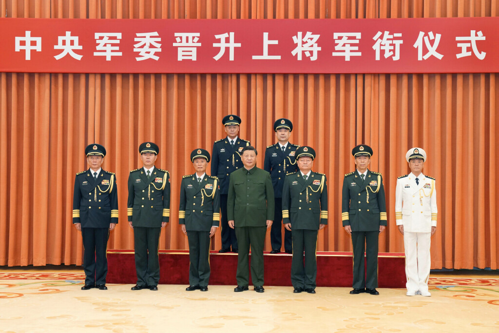 230731 -- BEIJING, July 31, 2023 -- Xi Jinping, chairman of the Central Military Commission CMC, and other leaders pose for a group photo with military officers who have been promoted to the rank of general in Beijing, capital of China, July 31, 2023. Xi on Monday presented certificates of order to promote two military officers to the rank of general at a ceremony. CHINA-BEIJING-XI JINPING-MILITARY OFFICERS-PROMOTION-CEREMONY CN LixGang PUBLICATIONxNOTxINxCHN