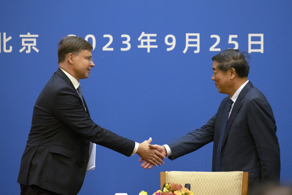 epa10882608 European Commission Executive Vice-President and Commissioner for Economy and Trade, Valdis Dombrovskis (L) and Vice-Premier of China He Lifeng shake hands after a press conference following the 10th EU-China High-Level Economic and Trade Dialogue (HED) in Beijing, China, 25 September 2023. EPA-EFE/ANDRES MARTINEZ CASARES