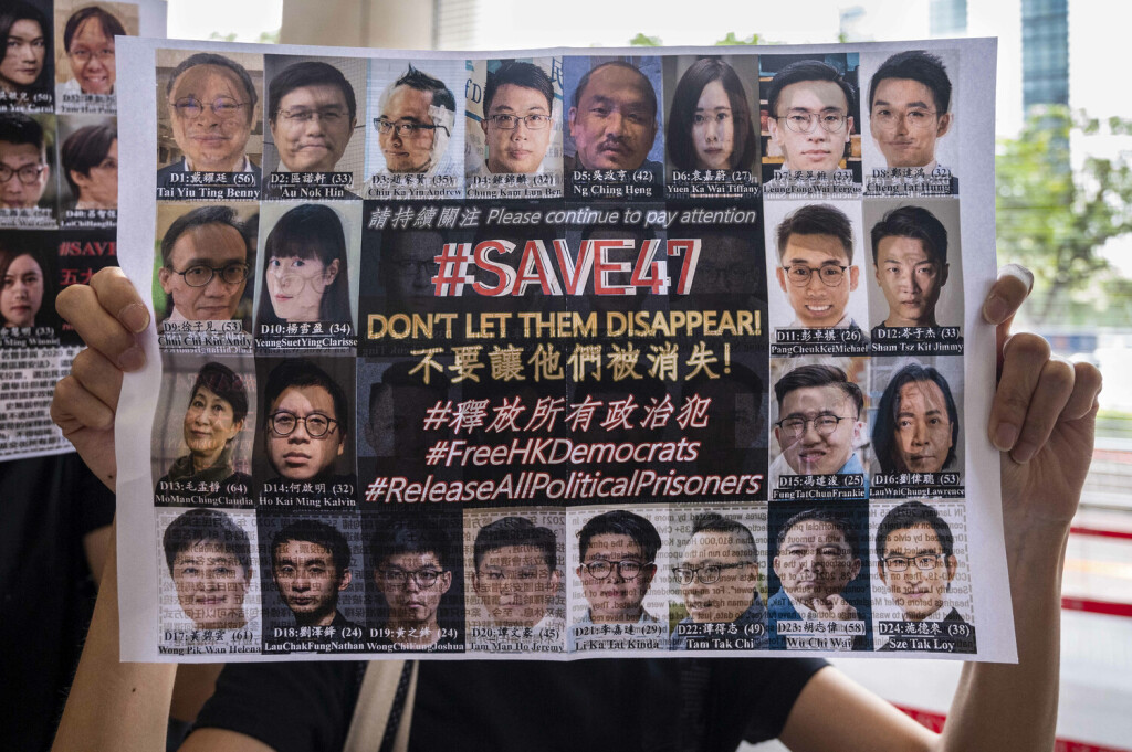 May 31, 2021, Hong Kong, China: A supporter holds a placard of pro-democracy figures on trial while queuing up in a line at the West Kowloon Law Courts Building in Hong Kong..47 pro-democracy activists have been charged under the national security law for subverting state power for participating in an unofficial primary in 2020 to choose pro-democracy candidates for the since-postponed legislative election. Hong Kong China - ZUMAs197 20210531_zaa_s197_036 Copyright: xMiguelxCandelax