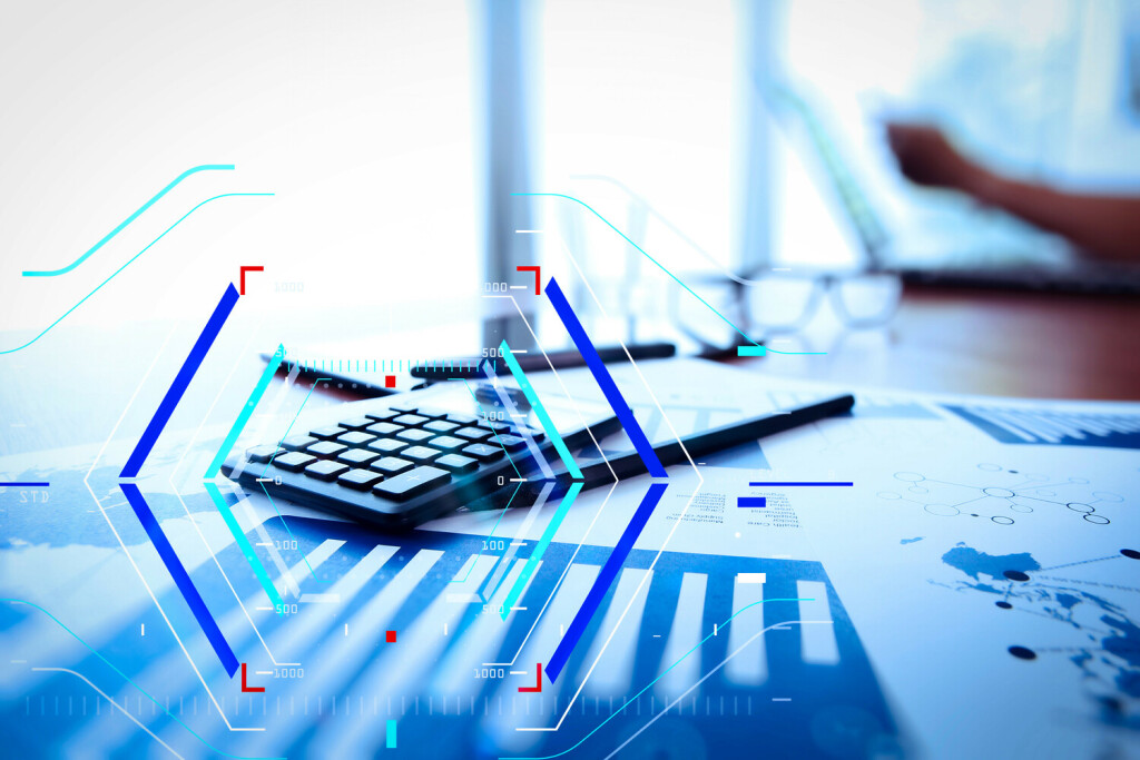 Concept of focus on target with digital diagram. business documents on office table with calculator and digital tablet and man working in the background