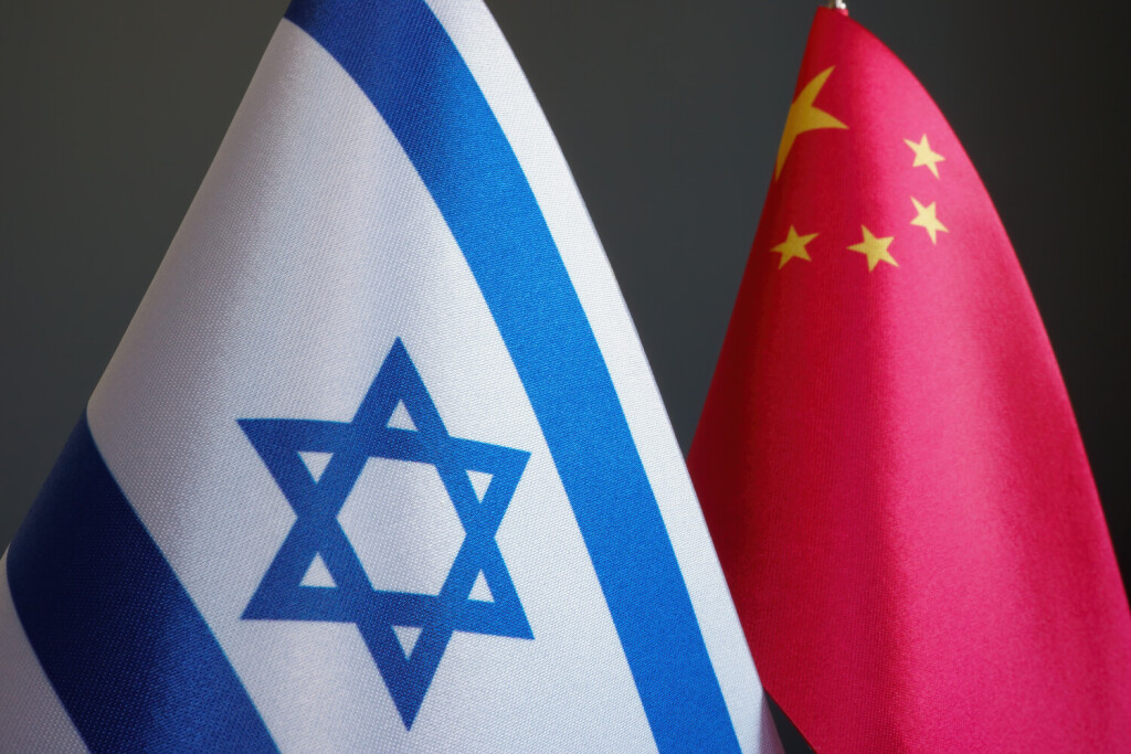 Near the small flags of Israel and China. xkwx israel, china, flag, chinese, israeli, agreement, cooperation, partnership, conflict, sanctions, government, relation, collaboration, business, company, relations, tensions